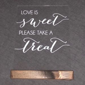 “Love is sweet please take a treat” sign